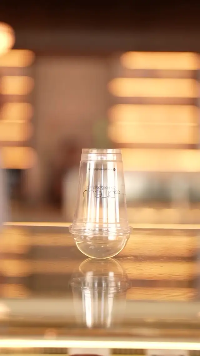 Smooth Plastic and Amber Light: AI Video Prompt for Iced Beverage Ads