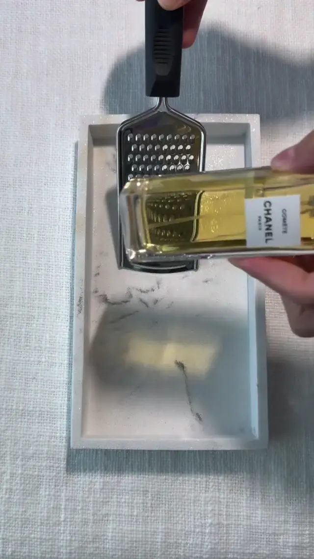 Grating a Perfume Bottle into Multiples: A Magical Product Prompt for AI Video