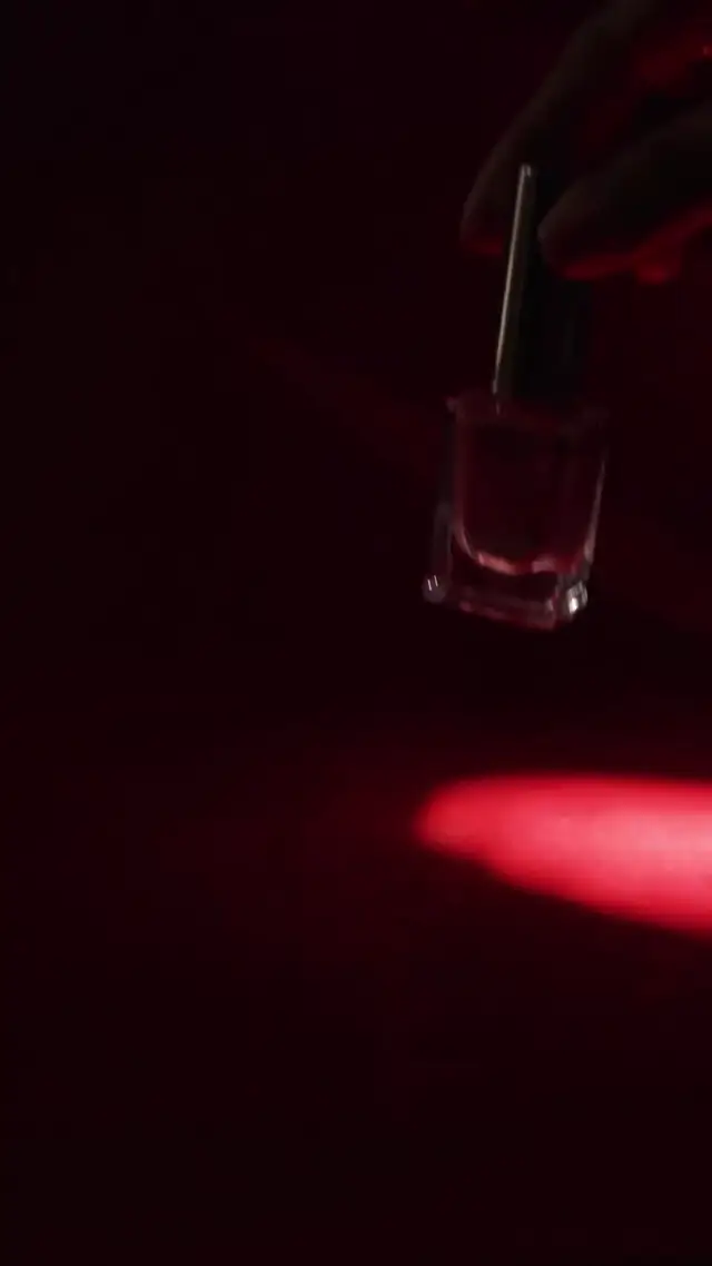 High-Gloss Product Cinematography with Dramatic Red Lighting AI Video Prompt