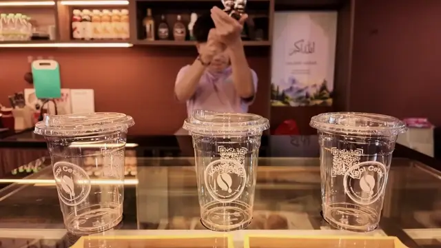 Magical Trick AI Video Prompt: Gun-Style Shaker Fills Drinks in Beat-Synced Commercial